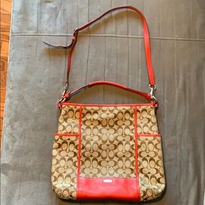 Brown Coach bag with red details